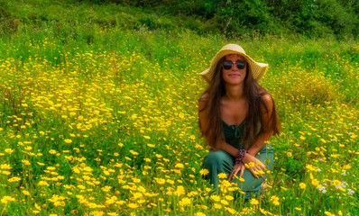 girl in a field of yellow flowers