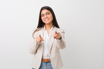 Young business arab woman isolated against a white background cheerful smiles pointing to front.