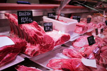 meats exposed in a central market butcher shop