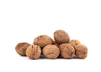 pile of inshell walnuts isolated on a white background
