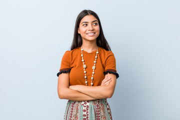Young arab woman smiling confident with crossed arms.