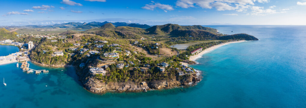 Aerial panoramic by drone of Caribbean Sea surrounding Deep Bay and Galley Bay, Antigua, Leeward Islands