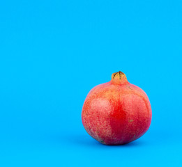 ripe red pomegranate in a peel