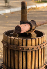 Wine-making. Technology of wine production. The folk tradition of making wine. The ancient tradition of grape processing in Moldova. Harvest home. The squeezer is used to press the wine.
