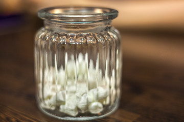 Sugar in a glass jar. Ingredient for a drink.
