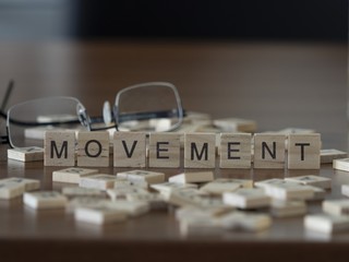 The concept of Movement represented by wooden letter tiles