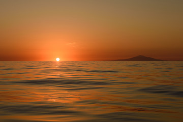 EVENING SUNSET IN THE SEA