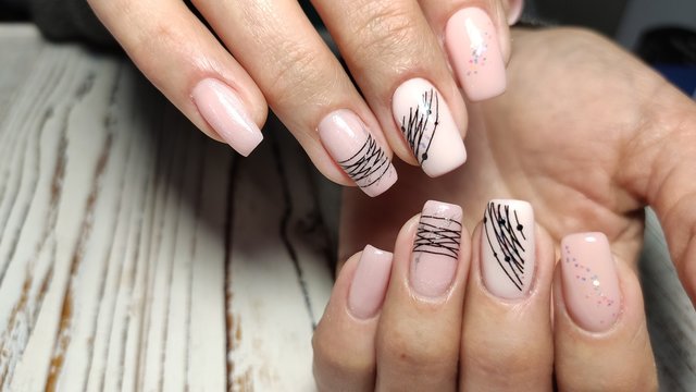 sexy pink manicure on long beautiful nails