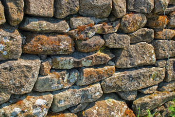 Stone wall. Abstract dry stones in boundary wall in Derbyshire Peak District countryside.  Stone material construction, natural and textured.