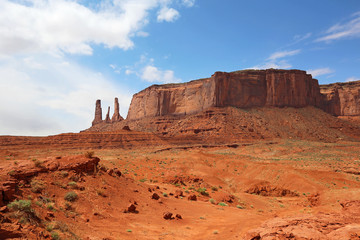 Fototapeta na wymiar Three Sisters and Mitchell Mesa - Monument Valley, Utah