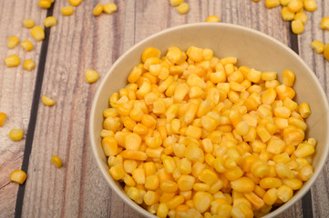 Grains of sweet corn in a plate on the table. Healthy diet. Fitness diet. For a sweet treat. Close up.