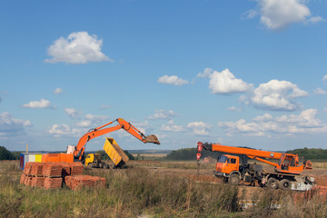 Industrial excavator on a construction site. Special equipment on the background of the landscape