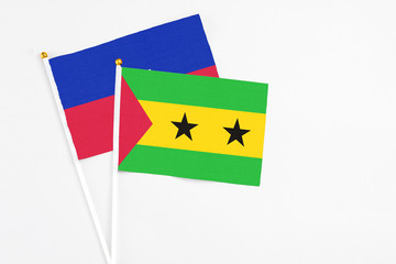 Sao Tome And Principe and Haiti stick flags on white background. High quality fabric, miniature...