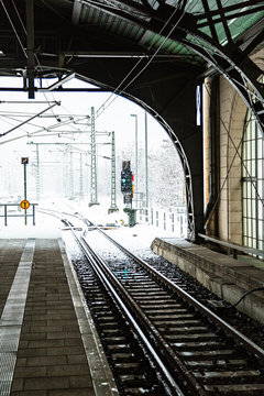 Train platforme with semaphore on snowy winter day