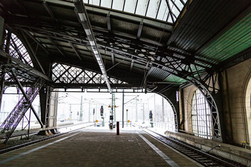 Empty european train station platform under roof