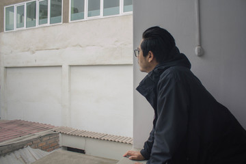 young man watching from the city