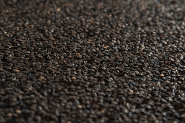 Background from buckwheat malt. Сereals for the production of alcoholic beverages and animal feed. Close-up groats. Macro texture of malt