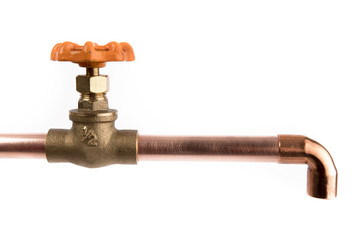 a brass plumbing shut off valve with an orange handle attached to a copper pipe with an elbow...