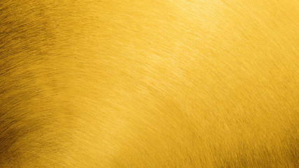 Scratched gold texture background. Golden metallic surface