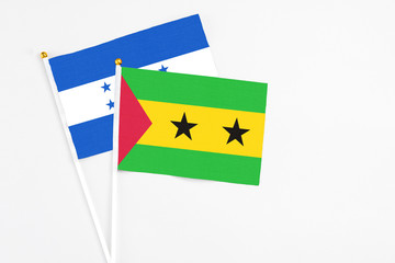 Sao Tome And Principe and Honduras stick flags on white background. High quality fabric, miniature...