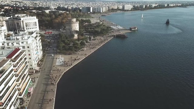 Thessaloniki urban drone shot with the white tower in the distance from unique angle