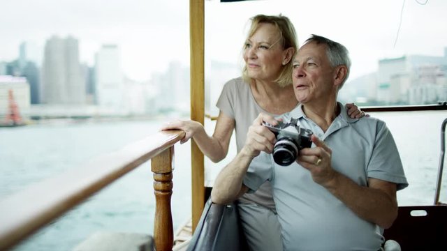 Male female couple taking travel photographs Hong Kong 