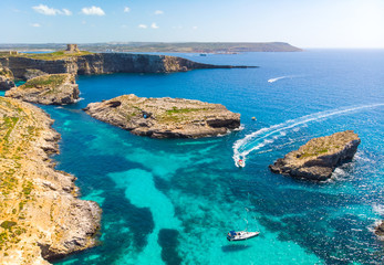 Fototapeta na wymiar Aerial view of Comino island and a few boats o the sea. Drone landscape. Europe. Malta 