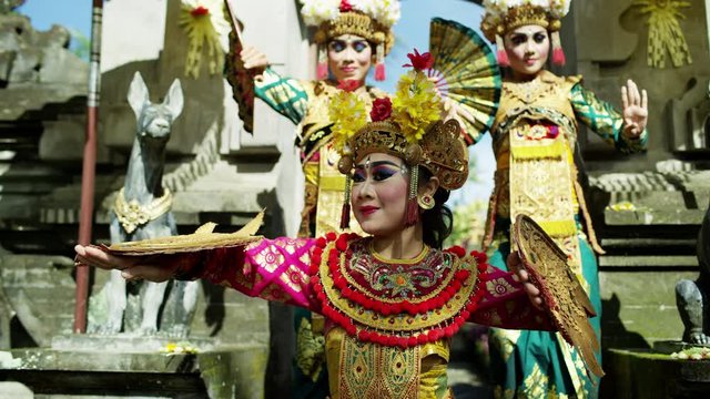 Females performing Legong dance to Hindu gods Indonesia