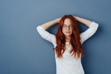 Serene serious young woman enjoying a moment