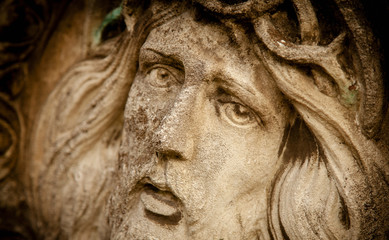 Fototapeta na wymiar Fragment of antique statue of Jesus Christ crown of thorns. Religion, faith, death, resurrection concept