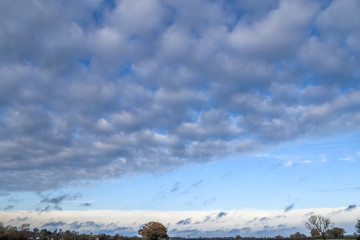 Beautiful white and grey clouds and cloud formations on a deep blue sky