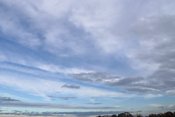 Beautiful white and grey clouds and cloud formations on a deep blue sky