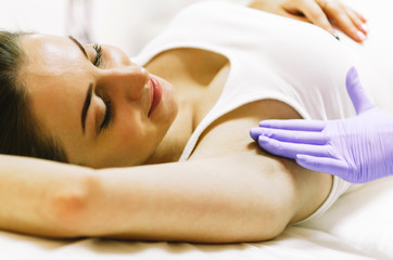 woman doing hot sugar wax hair removal