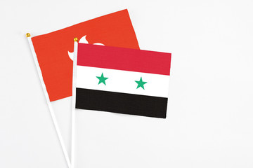 Syria and Hong Kong stick flags on white background. High quality fabric, miniature national flag....