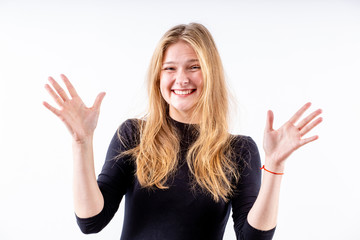 Fototapeta premium young beautiful blonde girl with a wide bright smile and outstretched arms on a white background