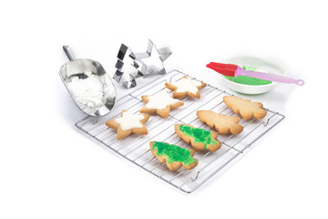 colorful icing on home made Christmas shaped cookies isolated on white