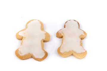 colorful icing on home made Christmas shaped cookies isolated on white