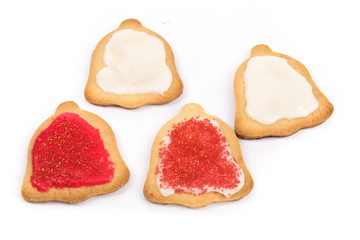 colorful icing on home made Christmas shaped cookies isolated on white