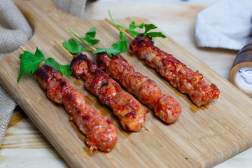 Pinchos morunos  or meat skewer. Typical Spanish cuisine dish made with pork or chicken carn marinated with garlic and paprika