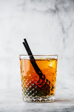 Glasse of iced black tea with lemon, overhead view. isolated on bright marble background. Overhead view, copy space. Advertising for cafe menu. Coffee shop menu. Vertical photo.