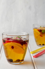Spiced apple mocktail with mint and cinnamon. wooedn background