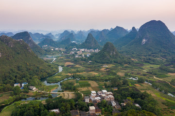 Fototapeta premium Drone Sunset View of Guilin, Li River and Karst mountains, Guilin city, Guangxi, province, China