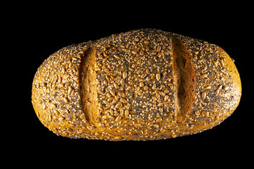  Cereal bread, view from above, on black background