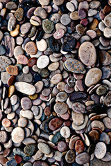 Many beautiful wet river stones in an abstract pattern. 