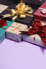 Christmas holiday composition. Various gift boxes on pastel purple background. Christmas, new year, birthday concept. Flat lay, top view, copy space