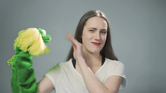 Video of young woman with handmade doll