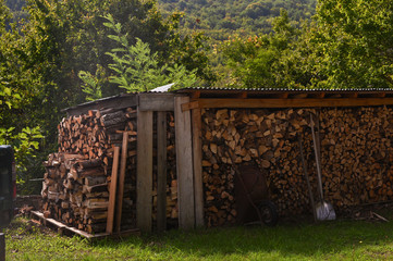 Chopped firewood for the fireplace. Autumn atmosphere in the mountains