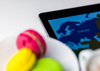 Bright Macaroons with Tablet and Europe map