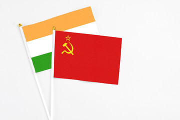 Soviet Union and India stick flags on white background. High quality fabric, miniature national flag. Peaceful global concept.White floor for copy space.