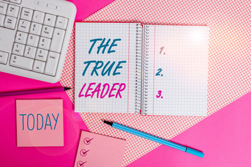 Handwriting text writing The True Leader. Conceptual photo one that move and encourage group of showing Responsibility Writing equipments and computer stuffs placed above colored plain table